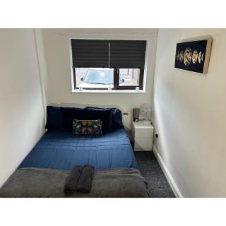 Enjoy a spacious lounge with a cozy sofa bed and a private ensuite bedroom - 6